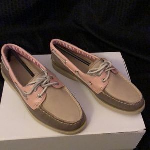 Sperry Topsider tan and pink boat shoes.
